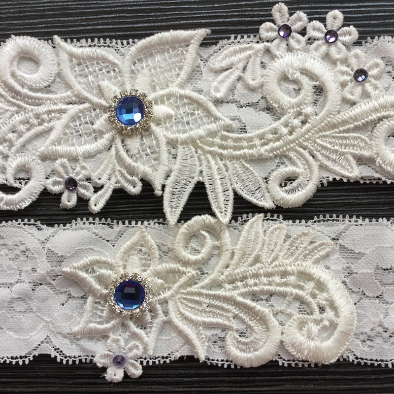 #07028173 Elegant Flower Ivory Lace Design Garter with Blue Rhinestones Embellishment