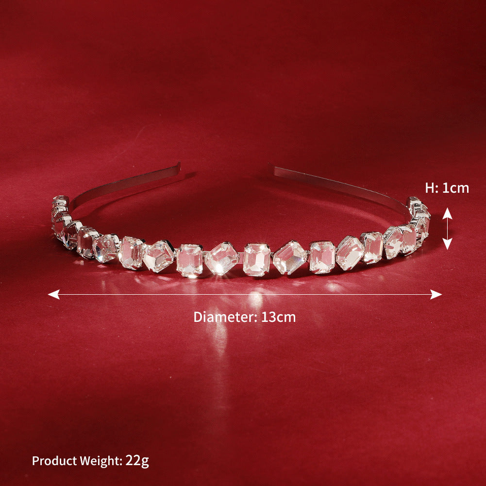 #23122773 Upgrade your look with our Deluxe Emerald Rhinestone Headband