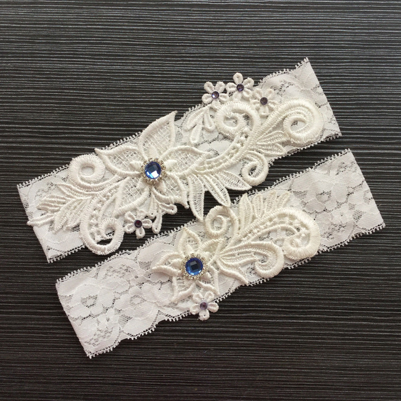 #07028173 Elegant Flower Ivory Lace Design Garter with Blue Rhinestones Embellishment