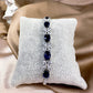 23117011 Bracelets en oxyde de zirconium (disponibles en argent, bleu et vert)