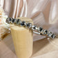 #23122773 Upgrade your look with our Deluxe Emerald Rhinestone Headband
